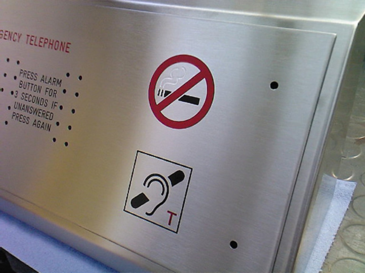 Engraved emergency and accessibility symbols