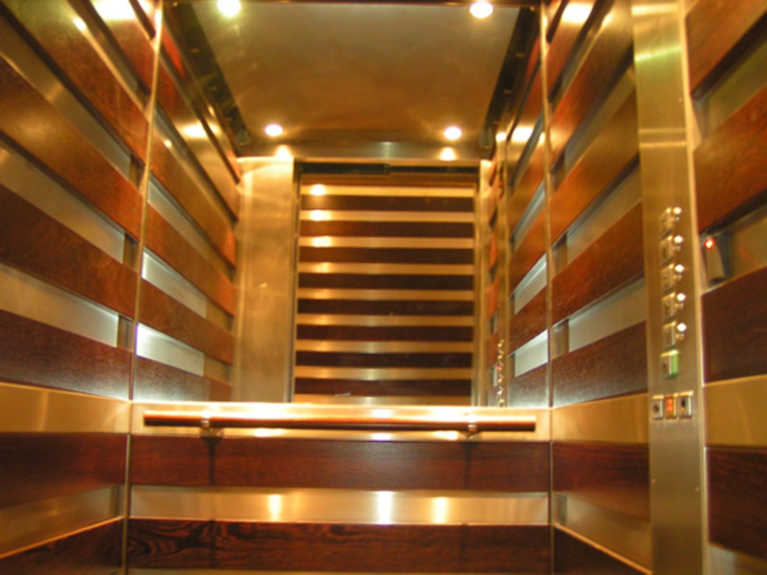 Reflective gold-toned lift interior