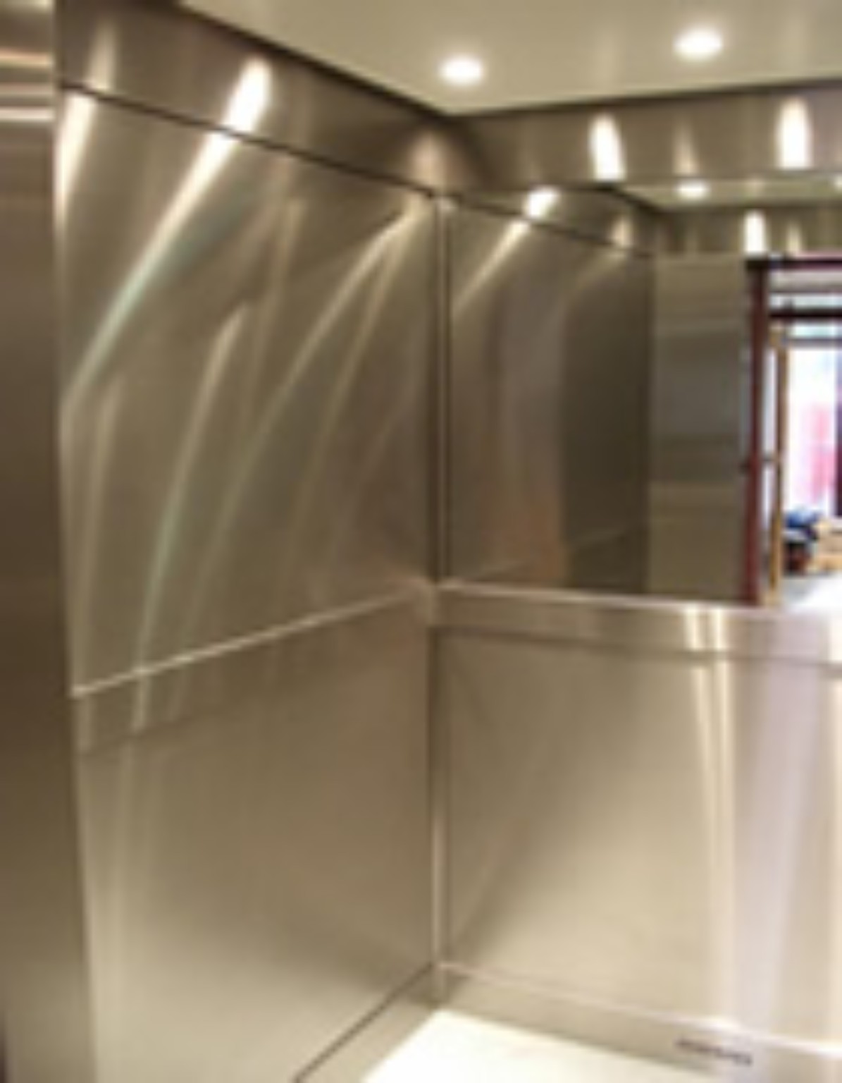 Lift interior after refurbishment with new stainless steel finishes